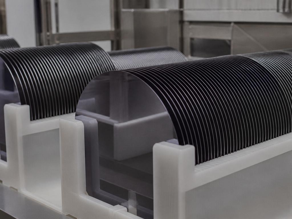 Silicon wafers stacked in a cleanroom carrier